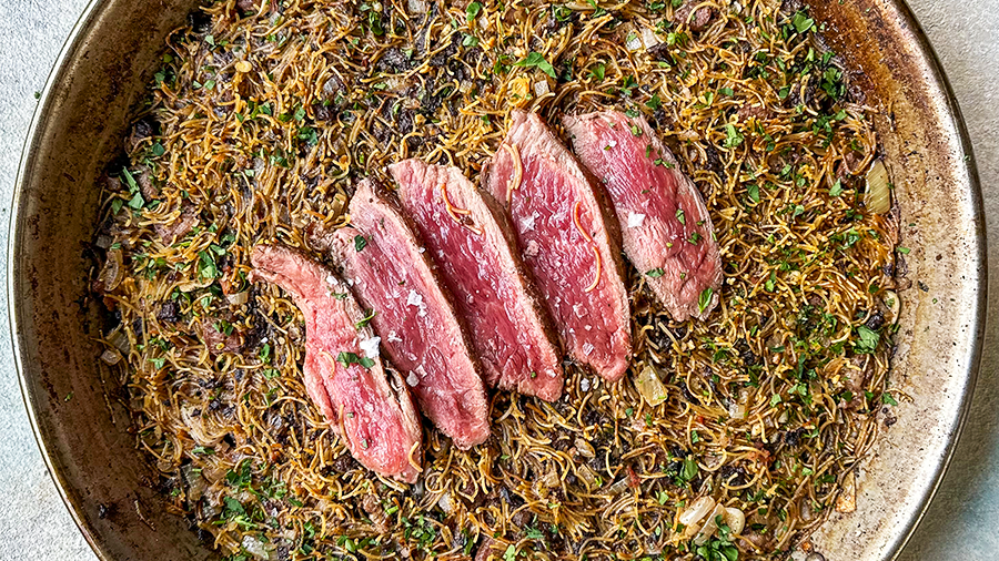 Spanish iberico meat with fideu pasta and morcilla