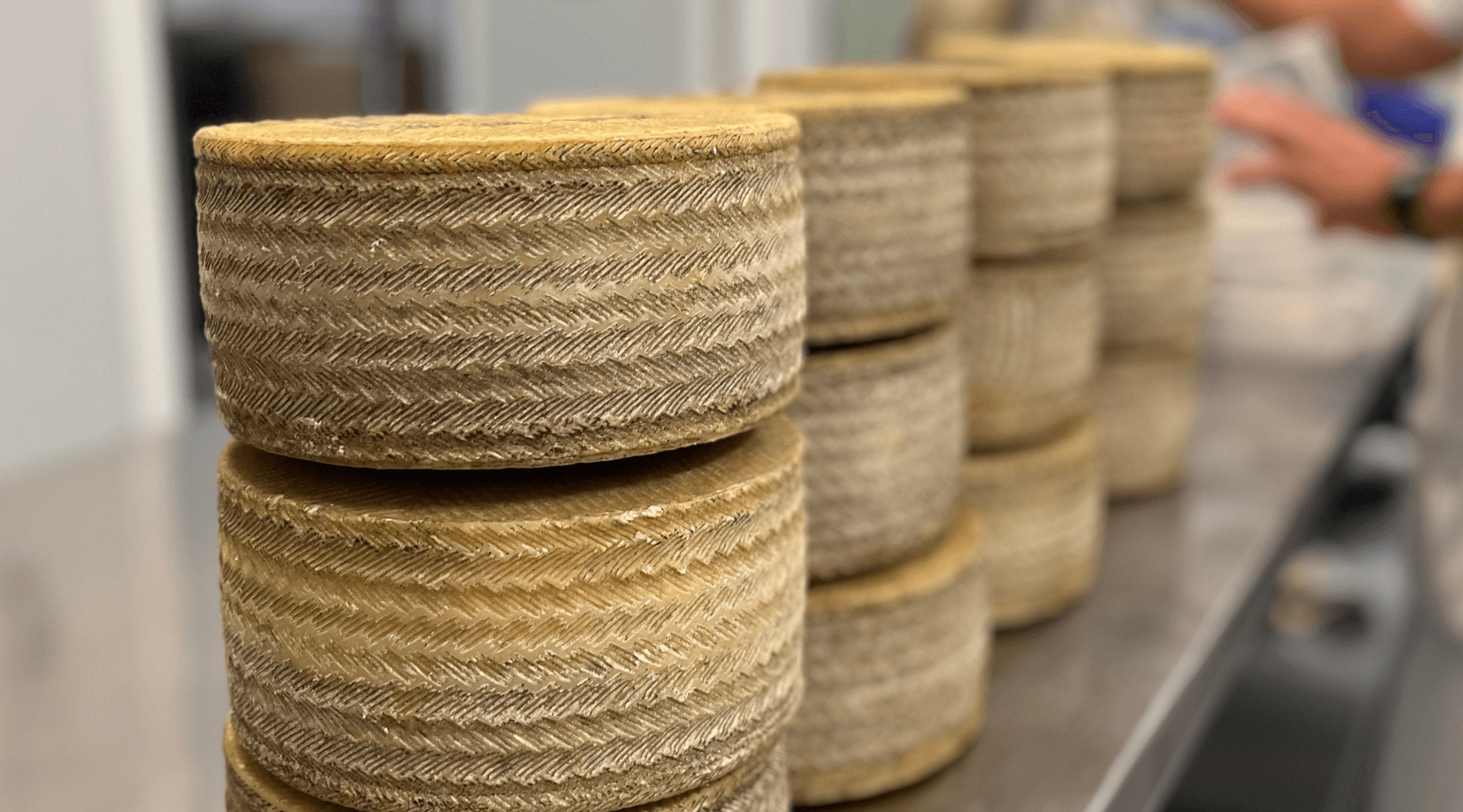 stacks of manchego cheese at the 1605 dairy in spain