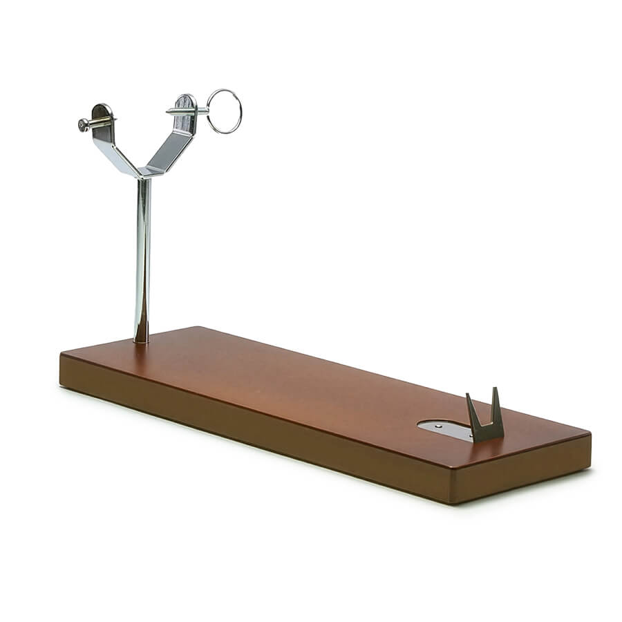 A ham stand with a rectangular brown base, a vertical metal post, and a silver metal ring holder on top, shown on a plain white background.