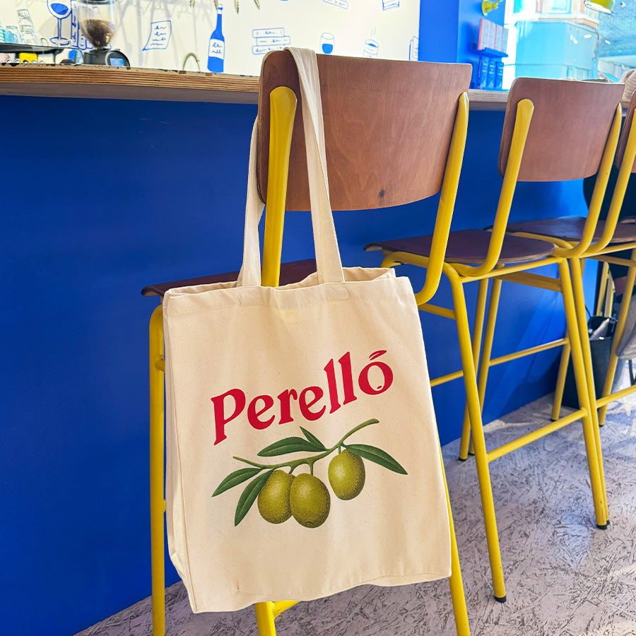 the perello tote bag hanging from a chair
