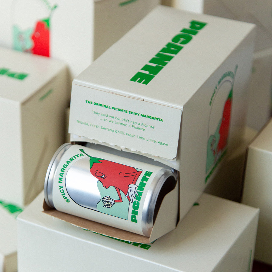 Can of Picante Spicy Margarita with open box packaging on a white background
