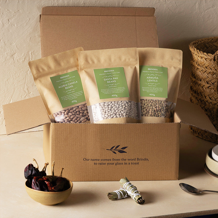 Monika's Rare Pulse Club box open on a counter with farcellet and peppers next to it