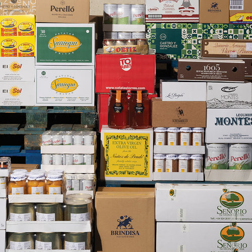 Stacks of various branded boxes and containers in a warehouse setting