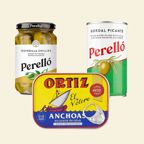 a selection of a Perello Gordal olives tin, a tin of Ortiz anchovies and a jar of Perello guindilla chillies