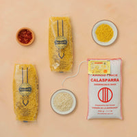 Packages of rice and pasta on a beige background