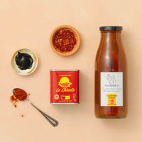 Spice containers, a can, and a bottle on a beige background