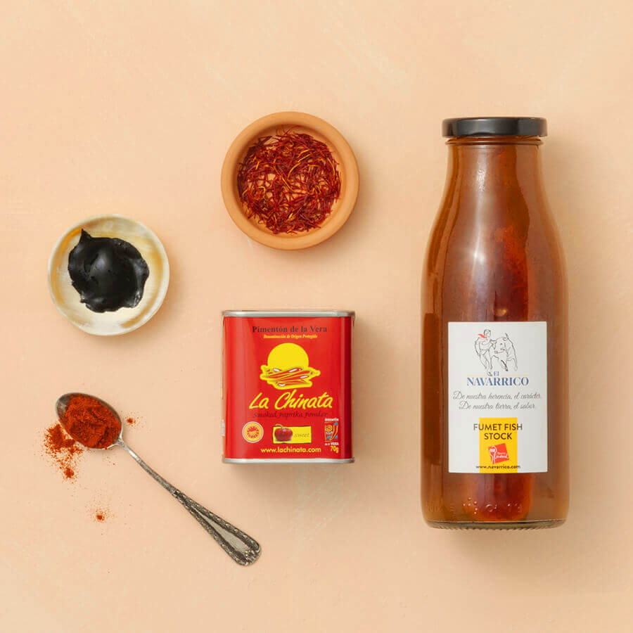 Spice containers, a can, and a bottle on a beige background