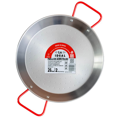 Steel paella pan on a white background