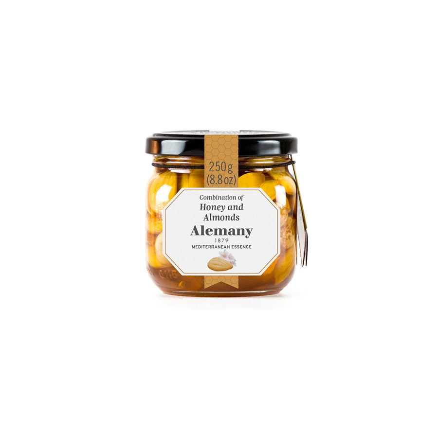 Jar of honey and almonds with a label on a white background