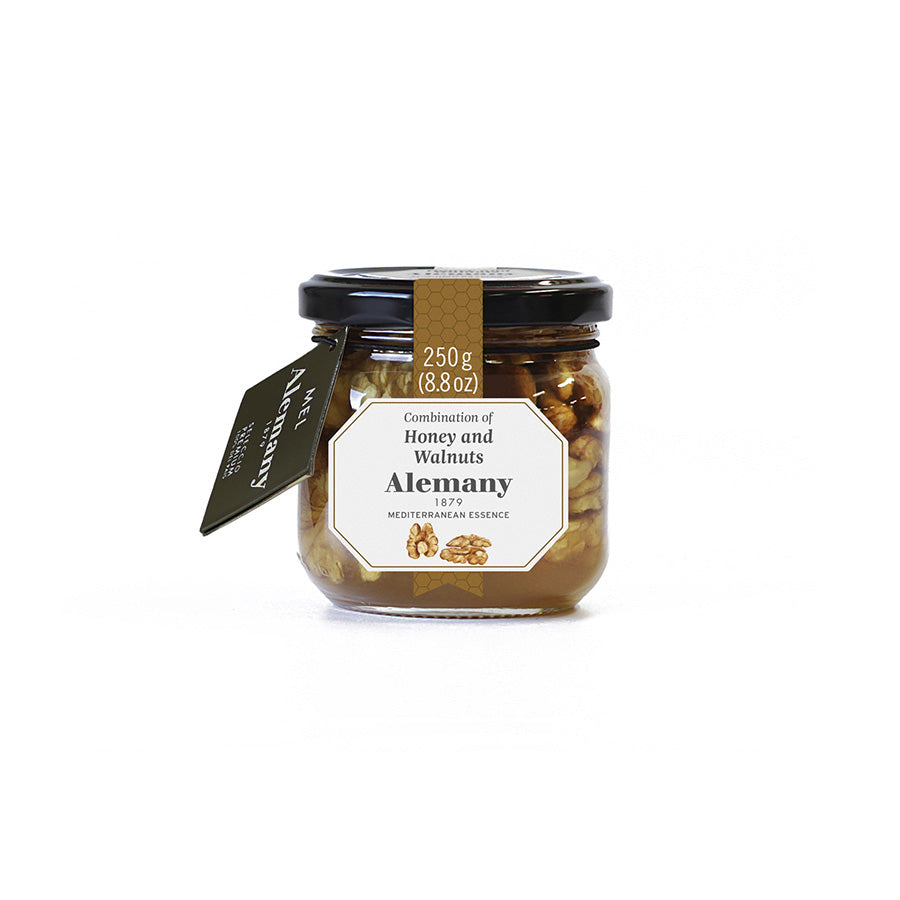 Jar of Alemany honey and walnuts with a label on a white background