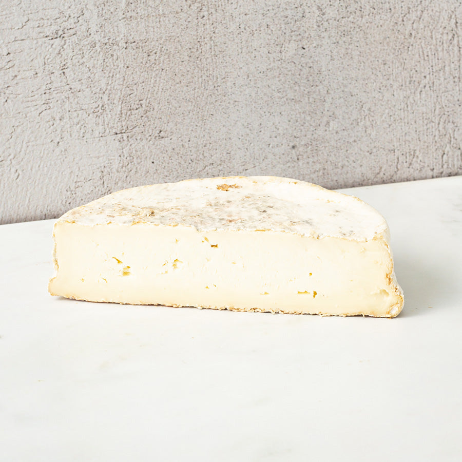 Pi mould ripened cheese half