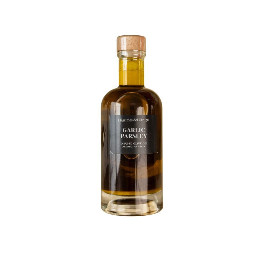 A clear glass bottle containing infused olive oil.
