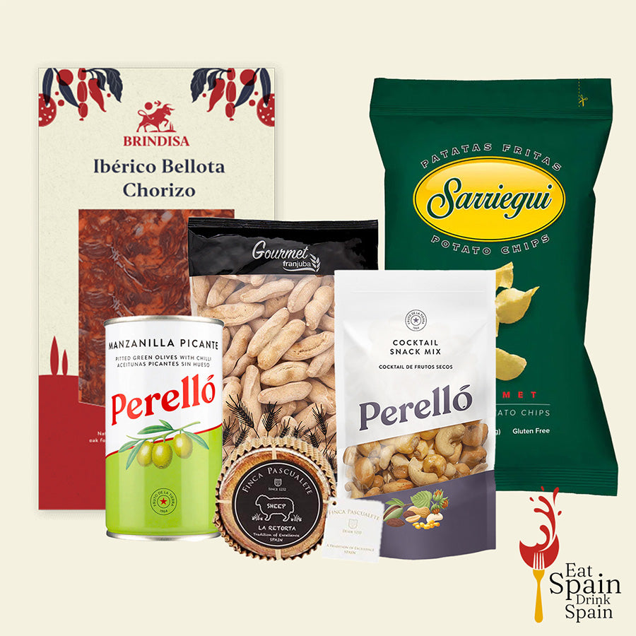 Collection of Spanish food products including chorizo, olives, nuts, and potato chips on a beige background.