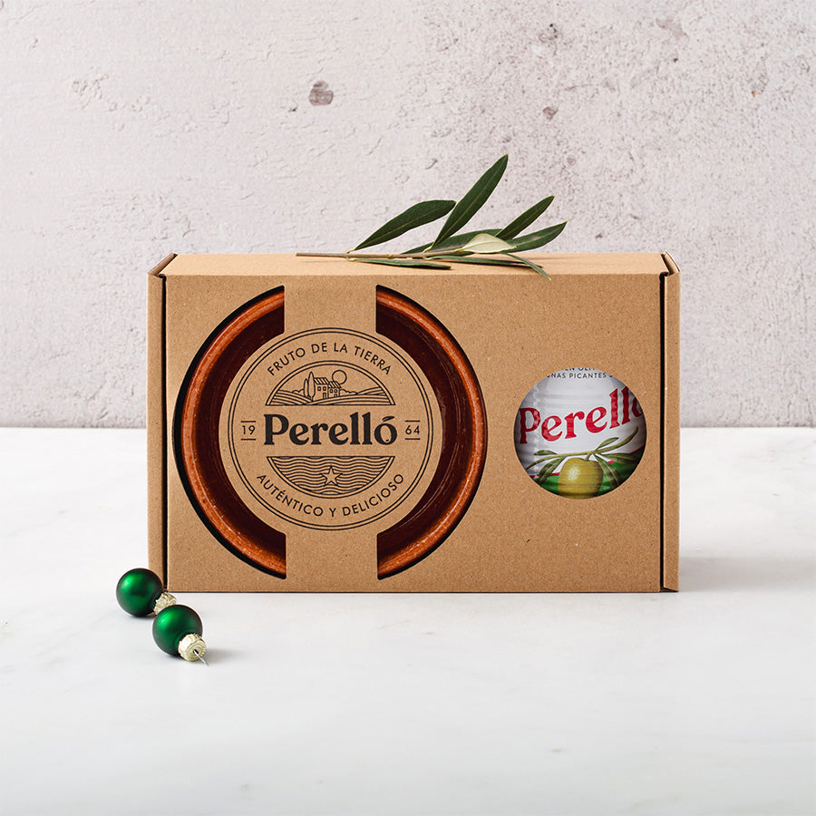 Perello gordal tin and a pereruela dish in a gifft box decotated with green Christmas baubles and an olive branch