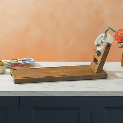 Plastic Ham Stand on a kitchen counter with a pink wall in the background