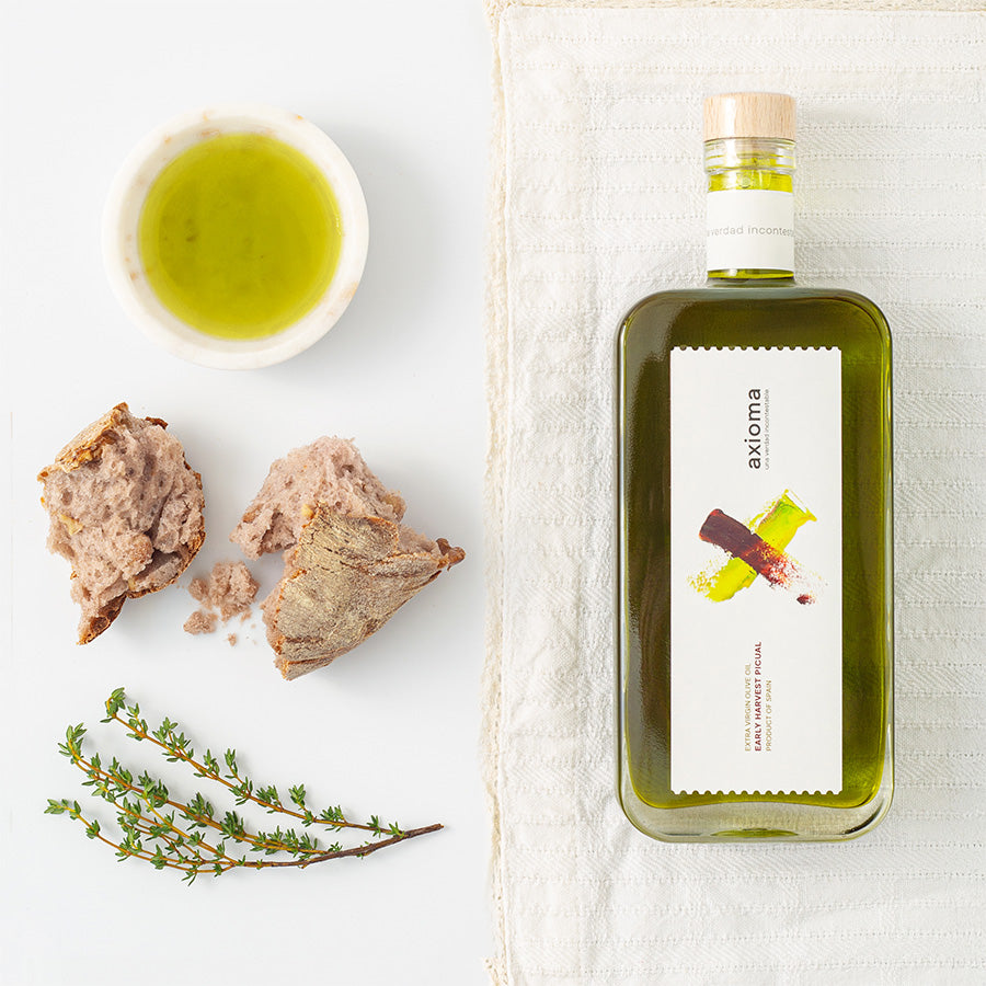 axioma olive oil with crusty bread and thyme on the side 