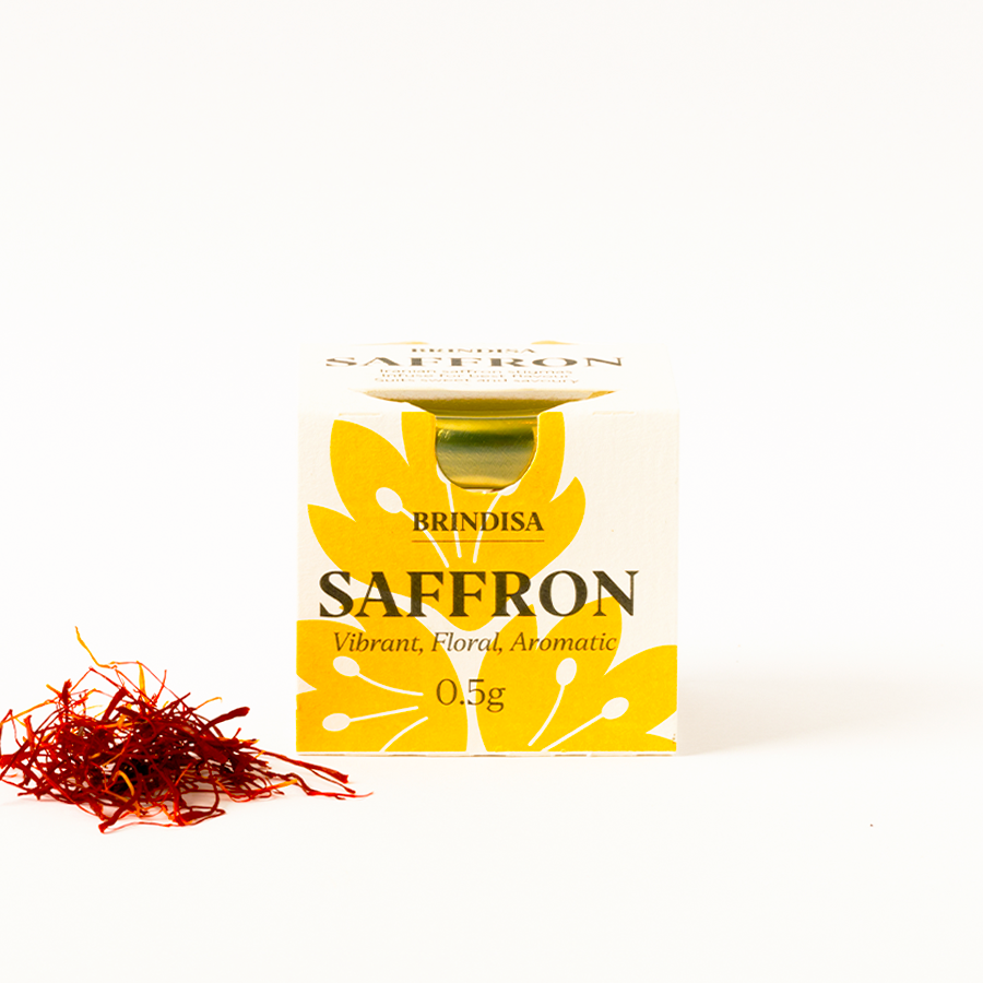 Brindisa saffron packaging with saffron strands on a white background