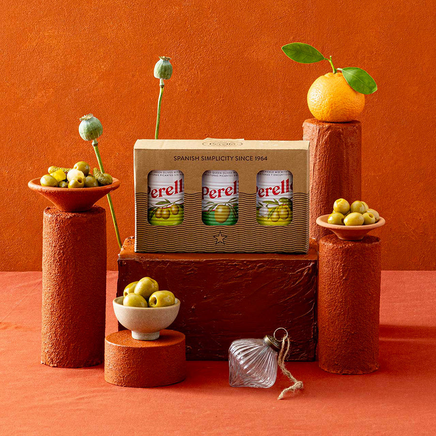 A perello olive gift set arranged on terracotta pedestals. 