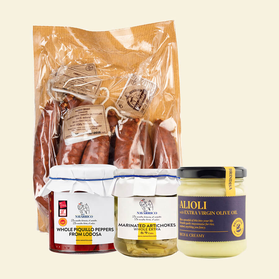 An Alejandro chorizo pack, with a jar of Brindisa alioli sauce, a jar of marinated artichokes and a jar of whole piquillo peppers.