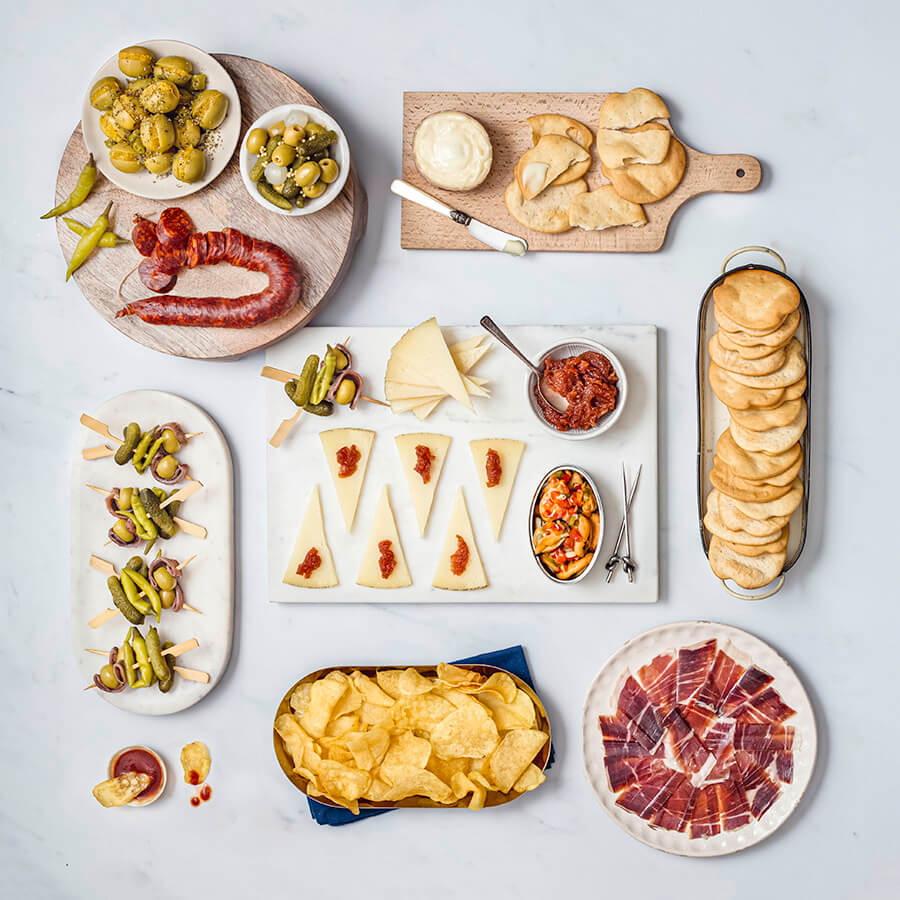 no cook tapas content olives with orange, chorizo, guindilla,s la retorta cheese, marineira olive oil crackers, manchego cheese, quince paste, mussels, iberico ham, crisps, hot sauce, gildas
