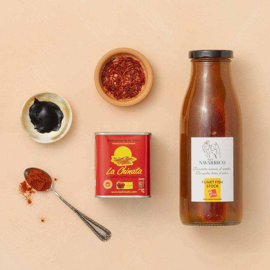 Spice containers, a can, and a bottle on a beige background