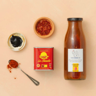 Spice containers, a can, and a bottle on a beige background