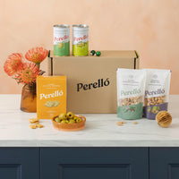 Perello brand products including cans, boxes, and packaging on a table with a neutral background
