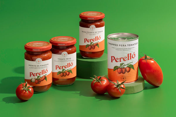 Three glass jars and one can of Perello  pera tomatoes arranged on a bright green studio background, with whole tomatoes placed around them.