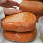 Mahon being rubbed with oil Brindisa cheese caves