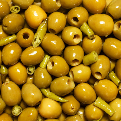 Perello olive tin selection of gordal, manzanilla and cocktail mix in a gift box decorated with Christmas green baubles and olive branches 