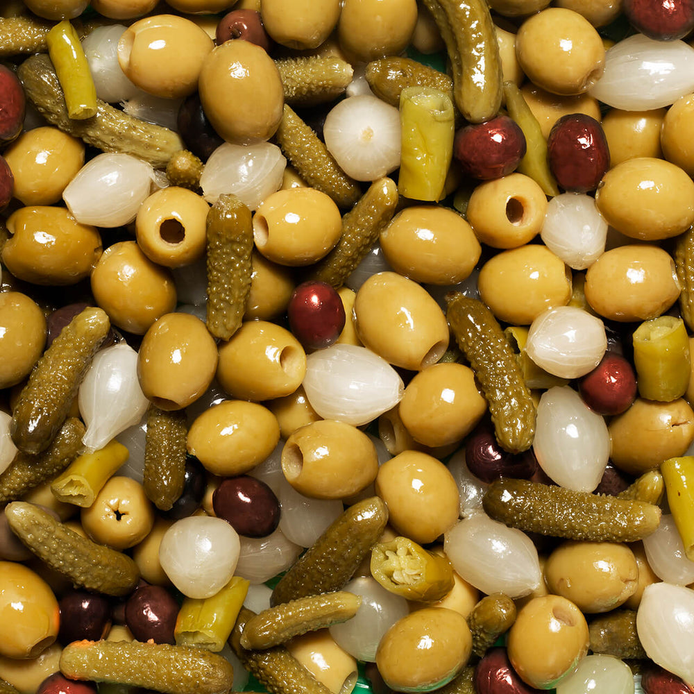 Perello olive tin selection of gordal, manzanilla and cocktail mix in a gift box decorated with Christmas green baubles and olive branches 