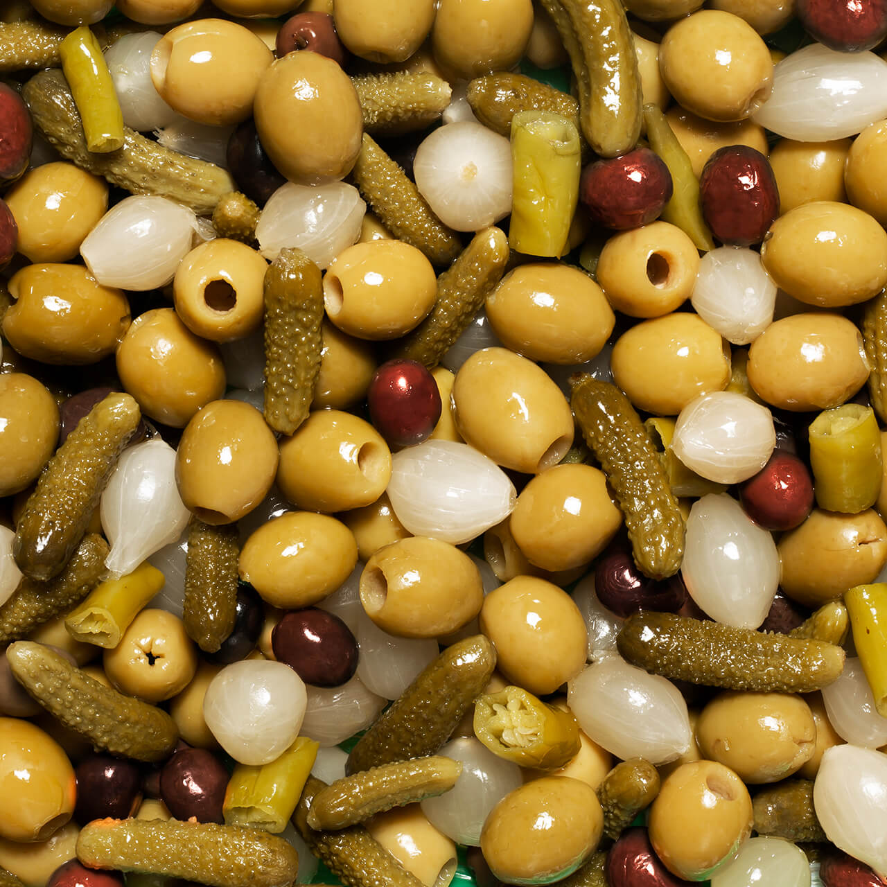 Perello olive tin selection of gordal, manzanilla and cocktail mix in a gift box decorated with Christmas green baubles and olive branches 